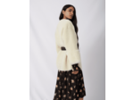 Manteau en peau lainée ceinturé