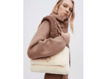 Blouson en fausse fourrure et maille