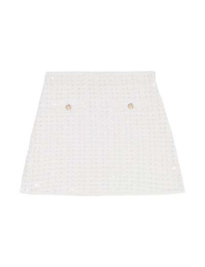 Jupe courte en maille à sequins